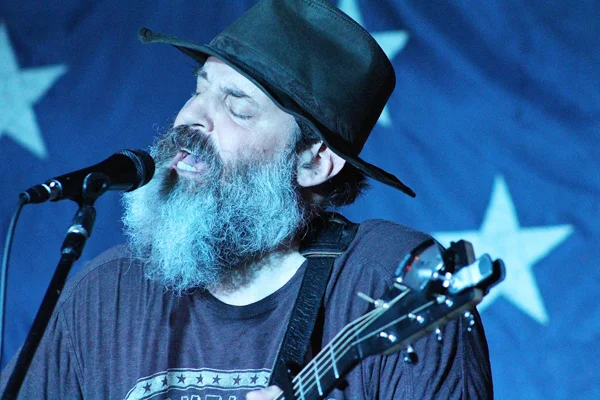 Bill Scorzari had a successful career as an attorney in New York City. These days you can find the Huntington-based musician on the road performing his original music.