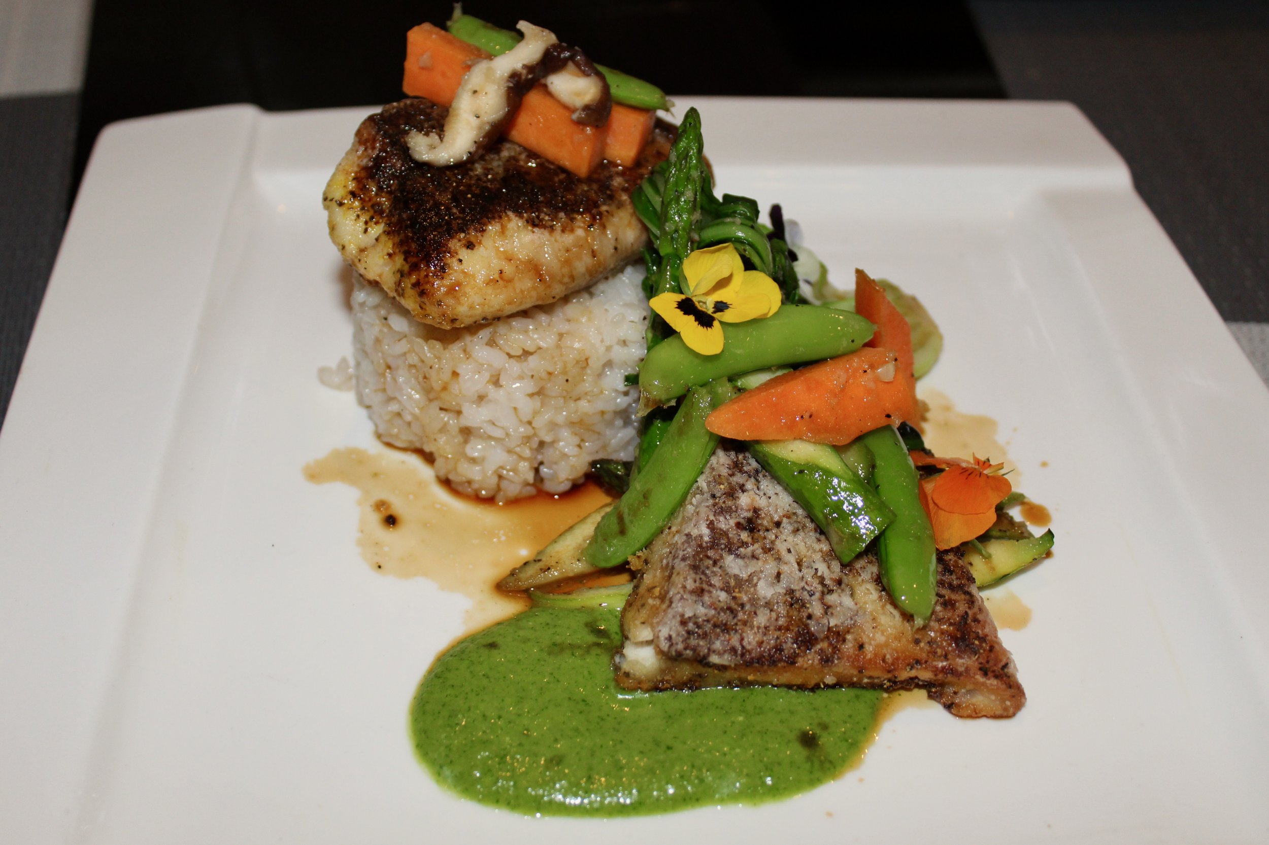 Pan-seared Wild Striped Bass with coconut rice, asparagus and jalapeno miso.