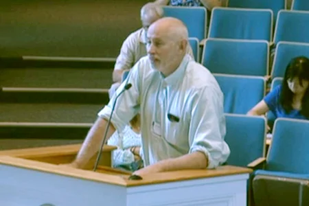 Huntington Township Housing Coalition president Roger Weaving speaks in support of less restrictive code governing accessory apartments. Changes enacted by the board earlier this month will allow more accessory apartments in areas where they were previously restricted.