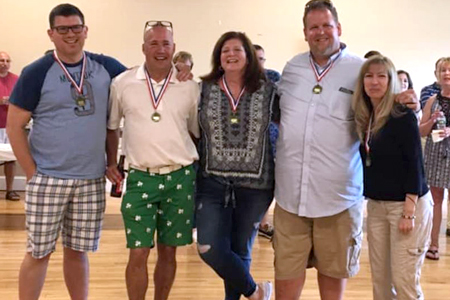 Winners of the inaugural Gerard Molloy Chili Cook-Off sponsored by Huntington Ancient Order of Hibernians, from left, are: Brian Rogers, Steve Fox, Deb Stolba, Bryan Kelly and Elaine Dougherty. The event honored the memory of Hibernian Gerard Molloy, inset at right, who died earlier this year.