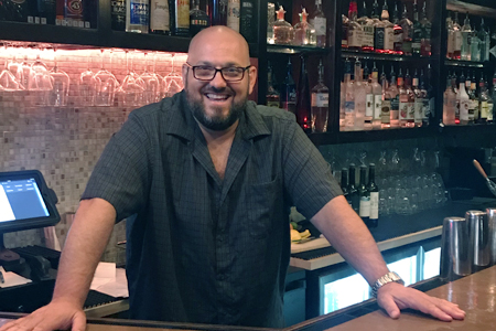  John Conzone mans the bar at Bar Petite in Huntington. 