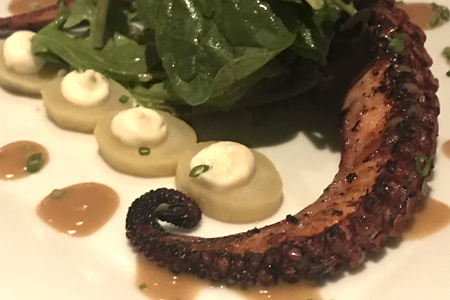  Grilled octopus with hazelnut vinaigrette. 