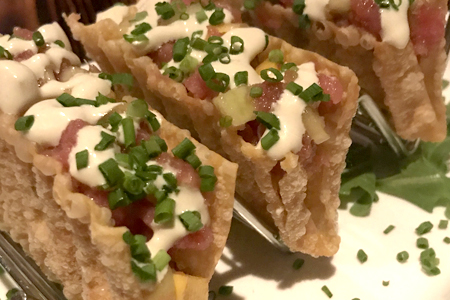  Sashimi tuna tacos with a cucumber-mango salsa. 