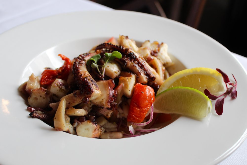  Grilled Octopus with white beans, onions, tomato, fennel. 