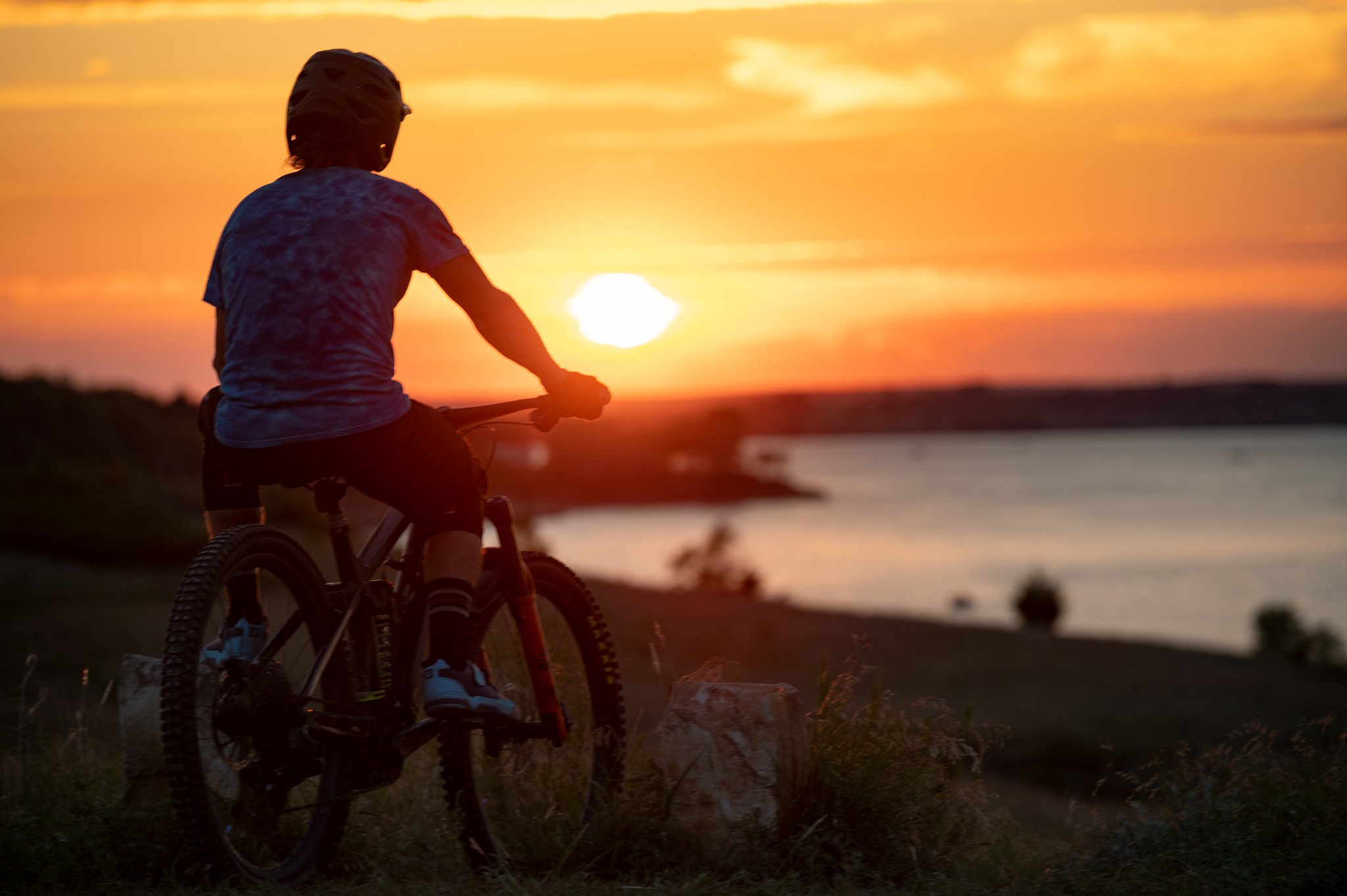electric-mountain-bike-rider-scenic-sunset.jpg