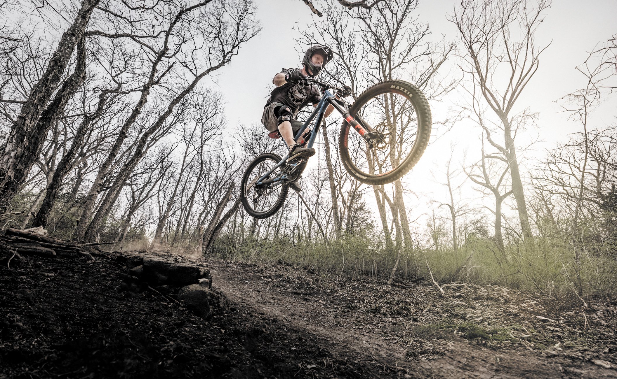 mountain-biker-jumping-with-full-face-helmet.jpg