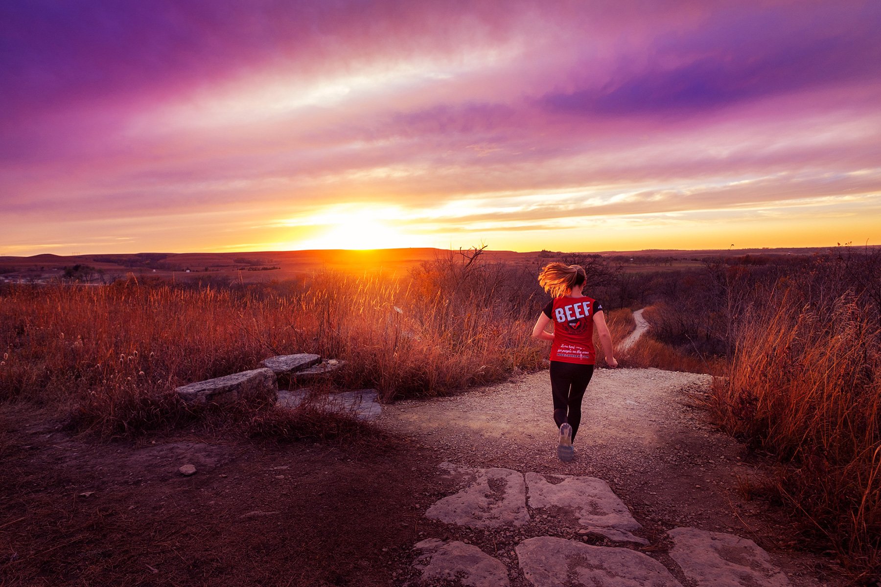woman-running-on-trail-in-sunset.jpg