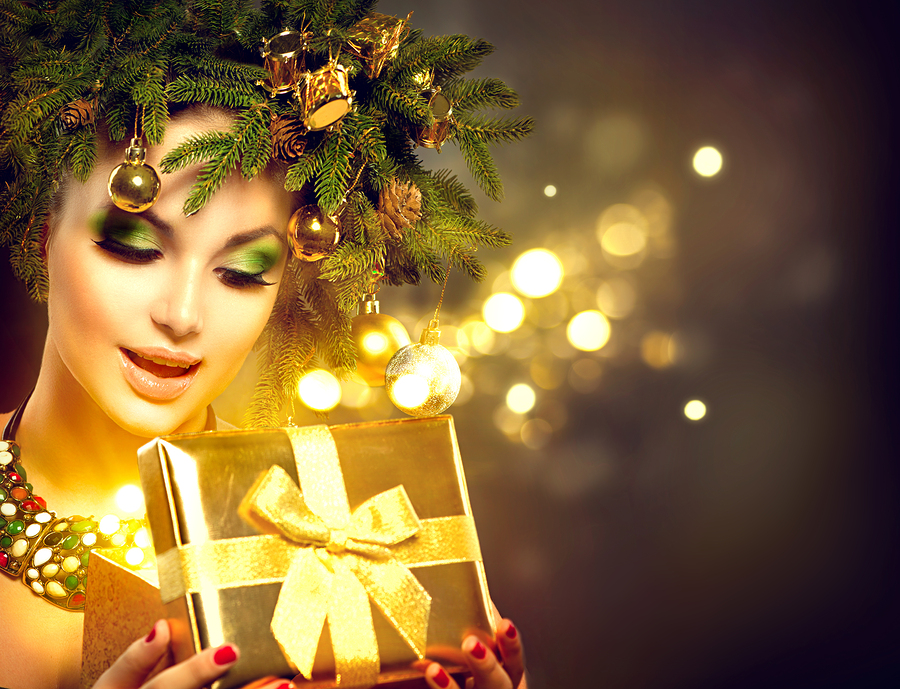 bigstock-Christmas-Winter-Woman-opening-110569373.jpg