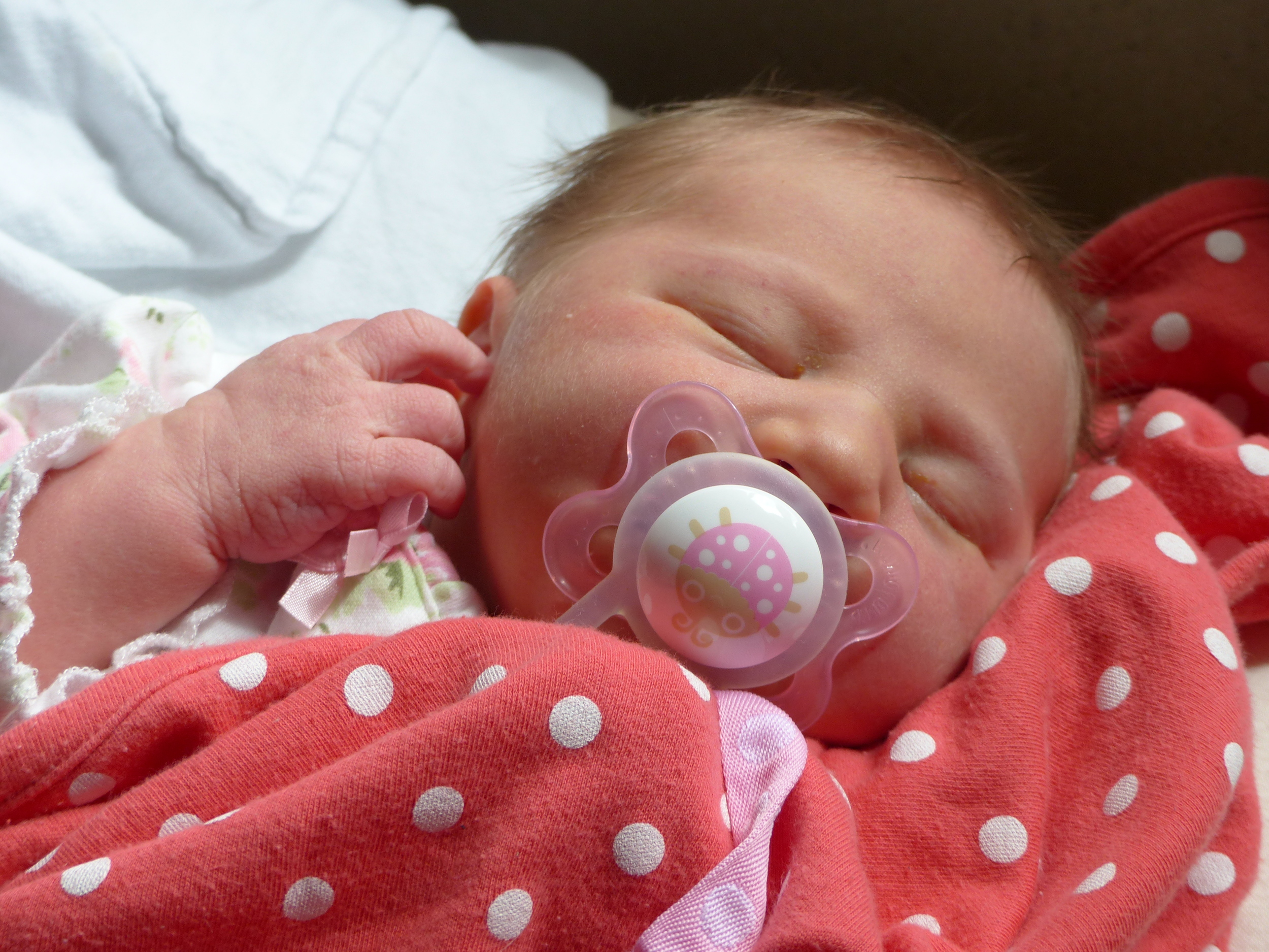 Getting ready to head home from the hospital. This was the first and one of the last times she successfully took a paci. I suppose it could be for the best, but I'll be a little sad if she doesn't take one. We loved the magic mute button with Jackson. {One day old.}