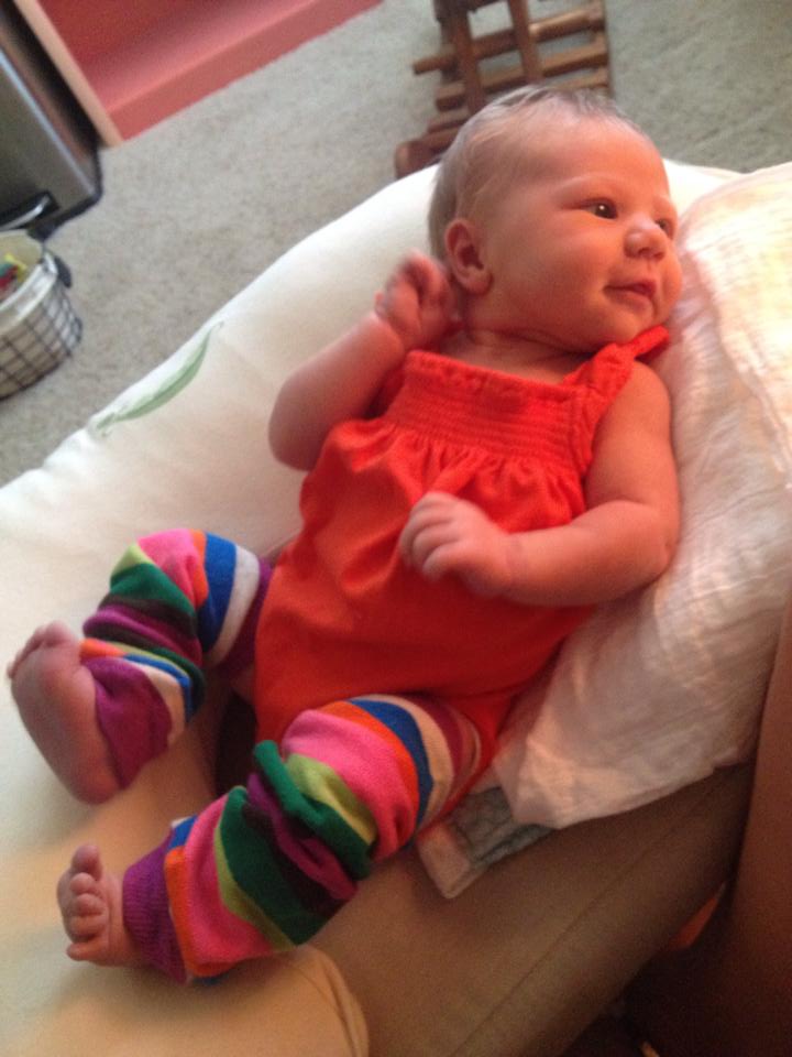 Pretty much my favorite picture ever. She's totally posing and turning to "find her light" so she can show off her first pair of baby legs. {Seven days old}