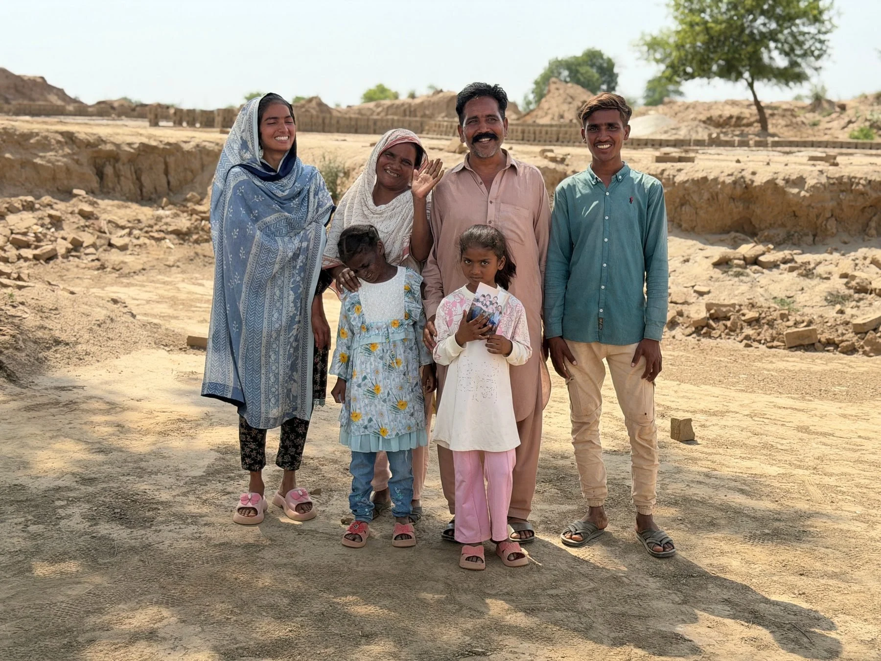 Javed Sher Masih and family at the brick kiln