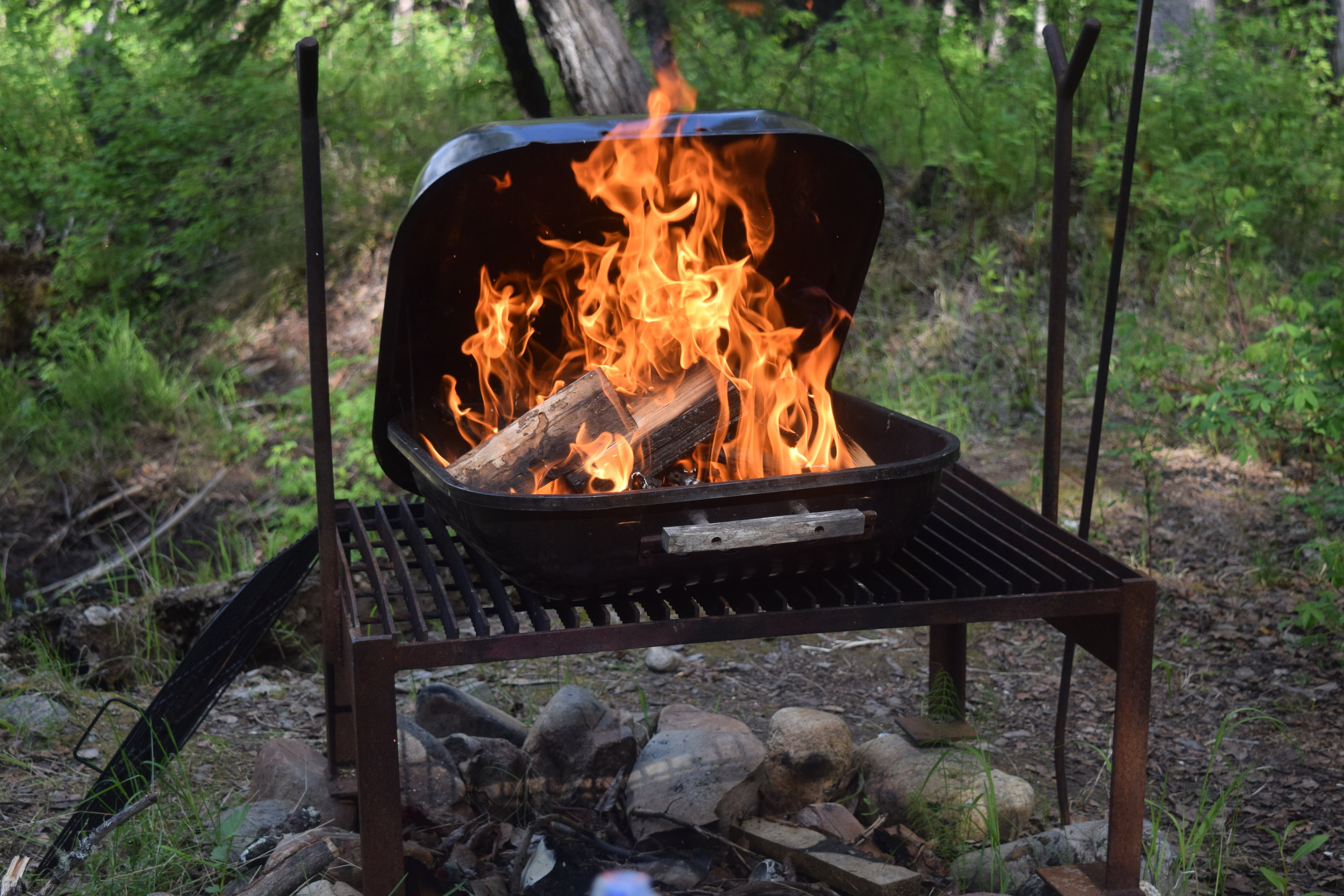 fire in a grill over a fire pit. Fairbanks, AK