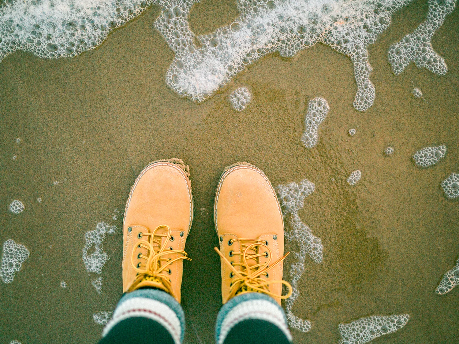 Photo #2 of my beloved boots, fast forward three seconds and the tide came right over them!