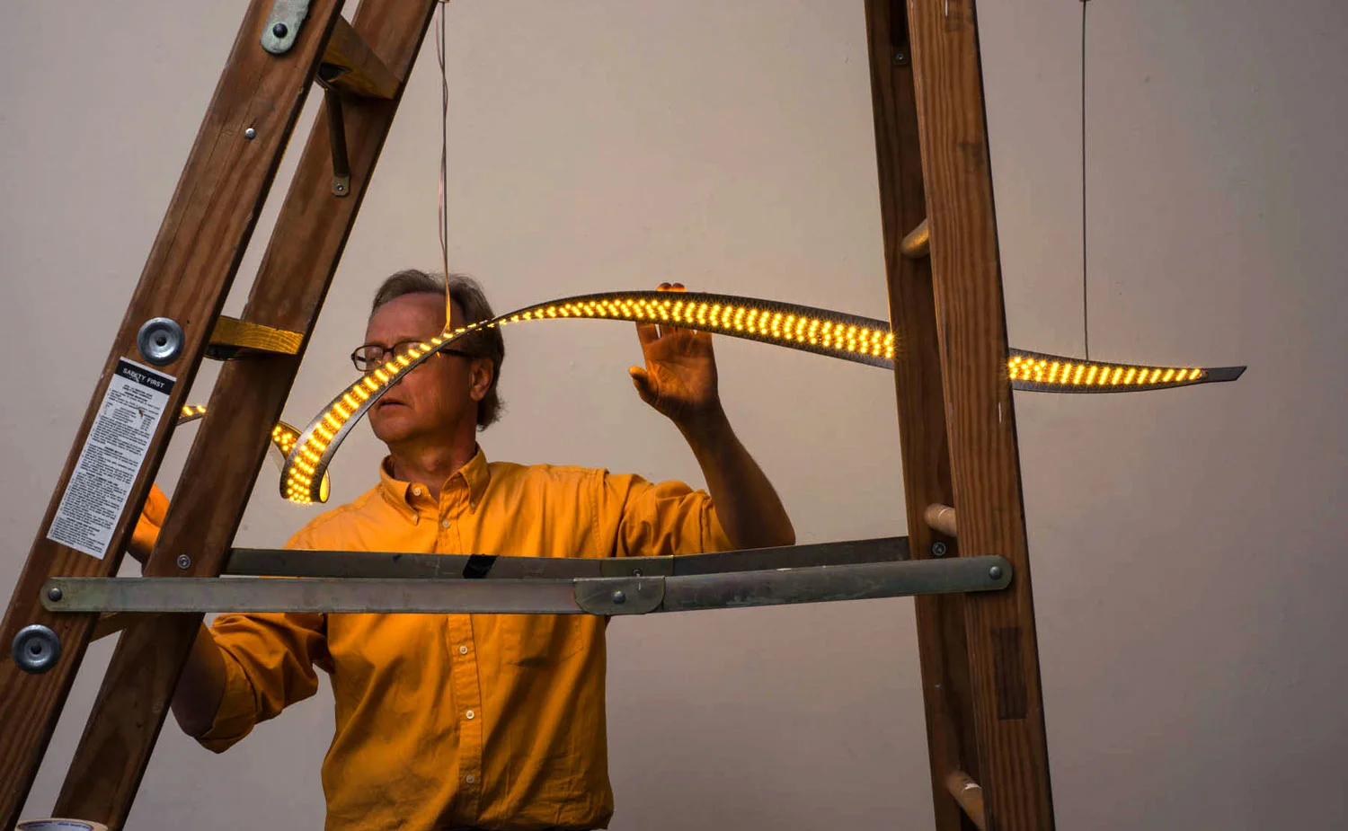 Industrial designer Jody Norskog testing a pendant