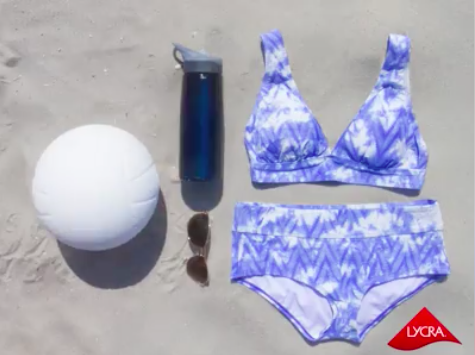 Ditch the lounge chair and dive into some fun under the sun! Swimsuits made with LYCRA® fiber offer a long-lasting shape and fit for when you're serving or spiking. #LYCRAMovesYou #sports #play #volleyball #beach #