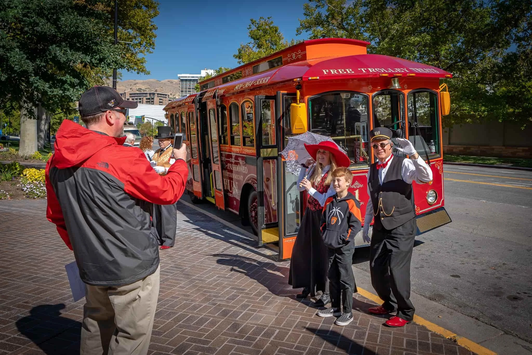Trolley customer takes photo of kids by trolley with Darby + Michael 2018  opt.jpg