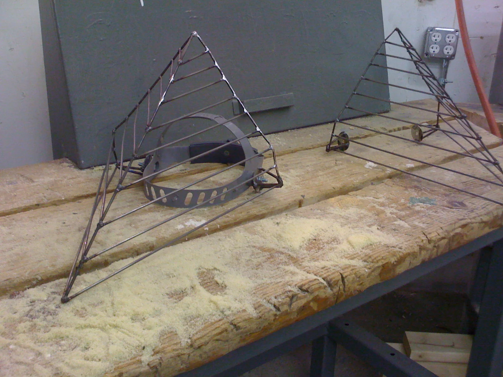 Completed masks in steel welded by artist Casey Bradley .