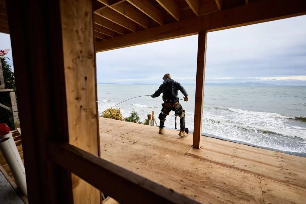 Measuring tape wrangler by the ocean