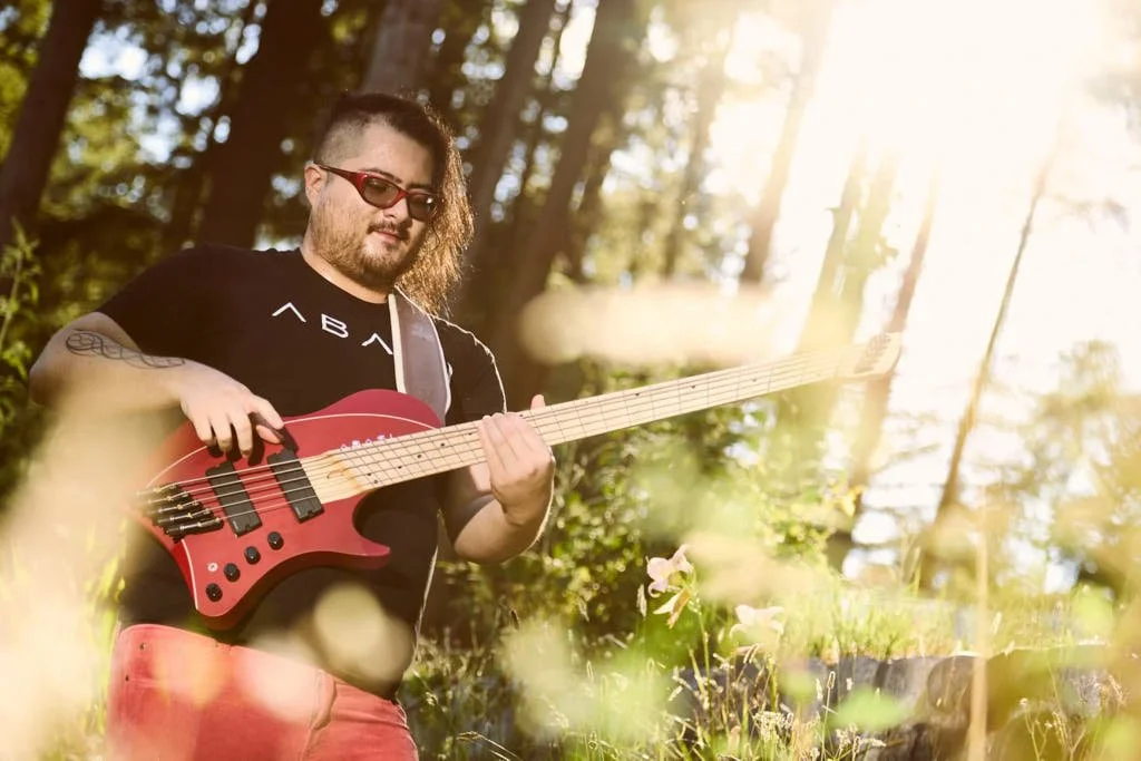 bassist playing in a BC forest.jpg