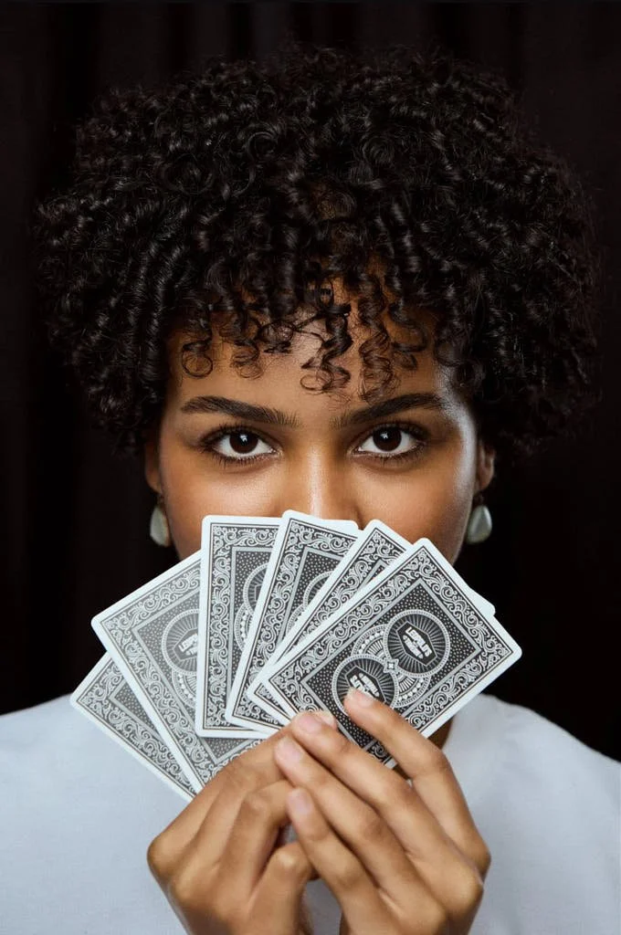 girl holding playing cards from Leo's Tavern.jpg