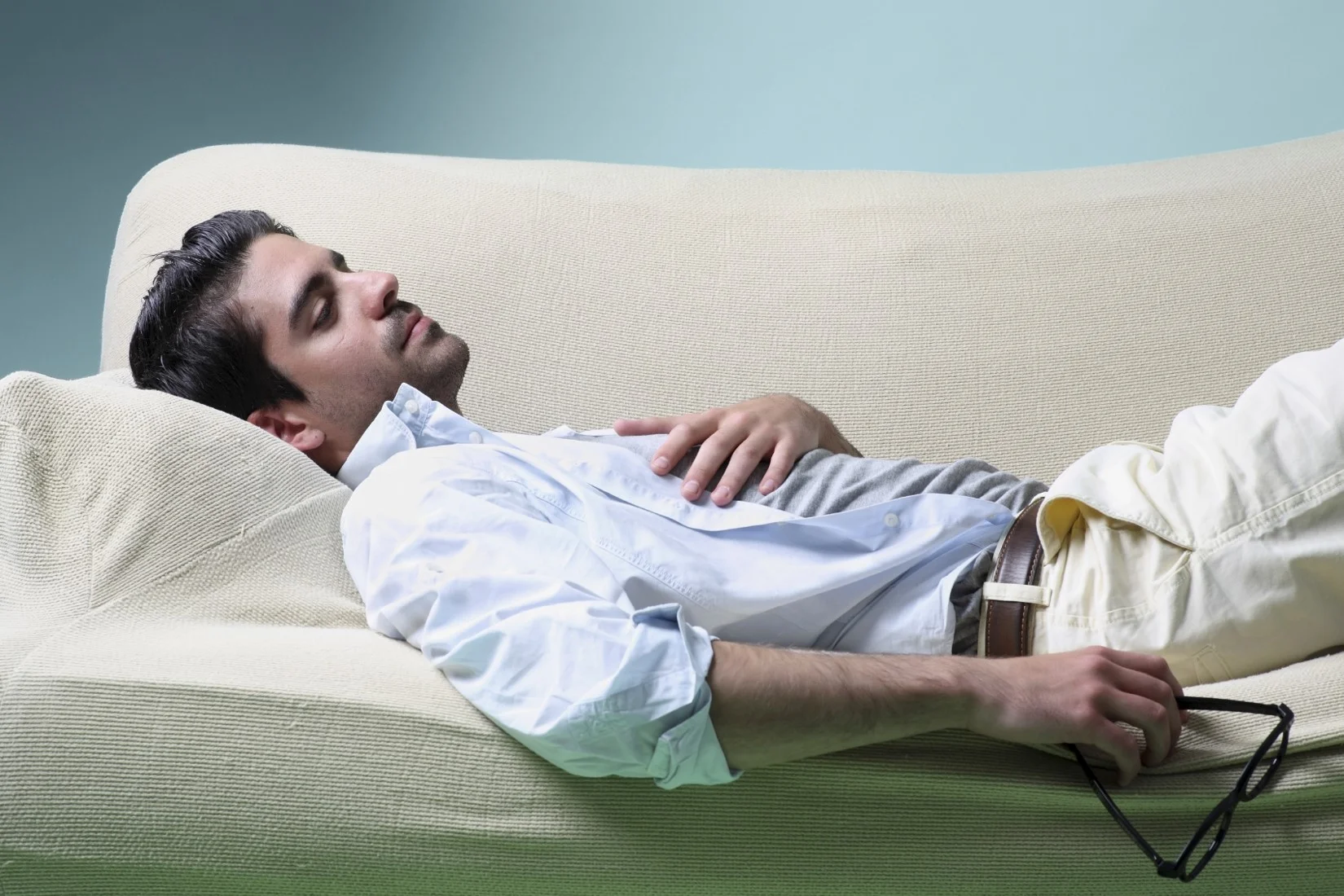 iStock_Man reclining on couch compressed.jpg