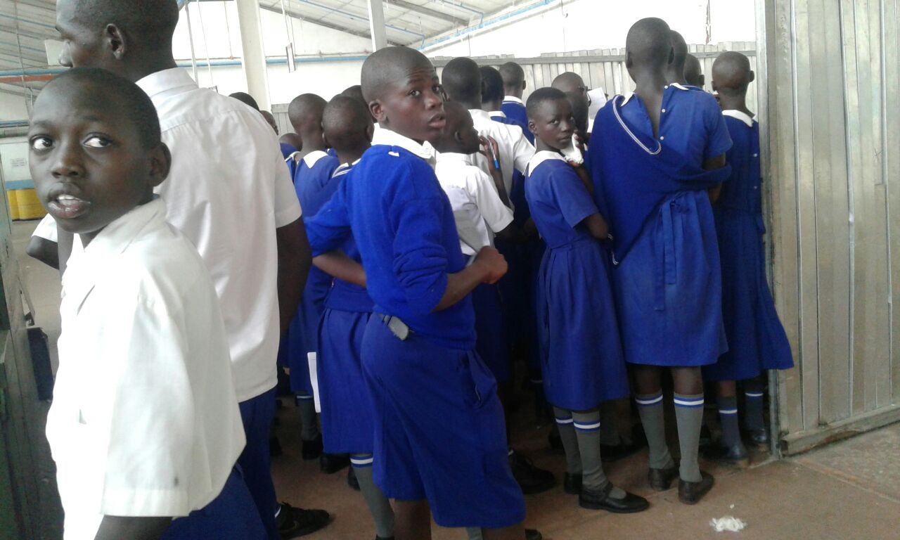 Pupils on a tour of a textile factory.