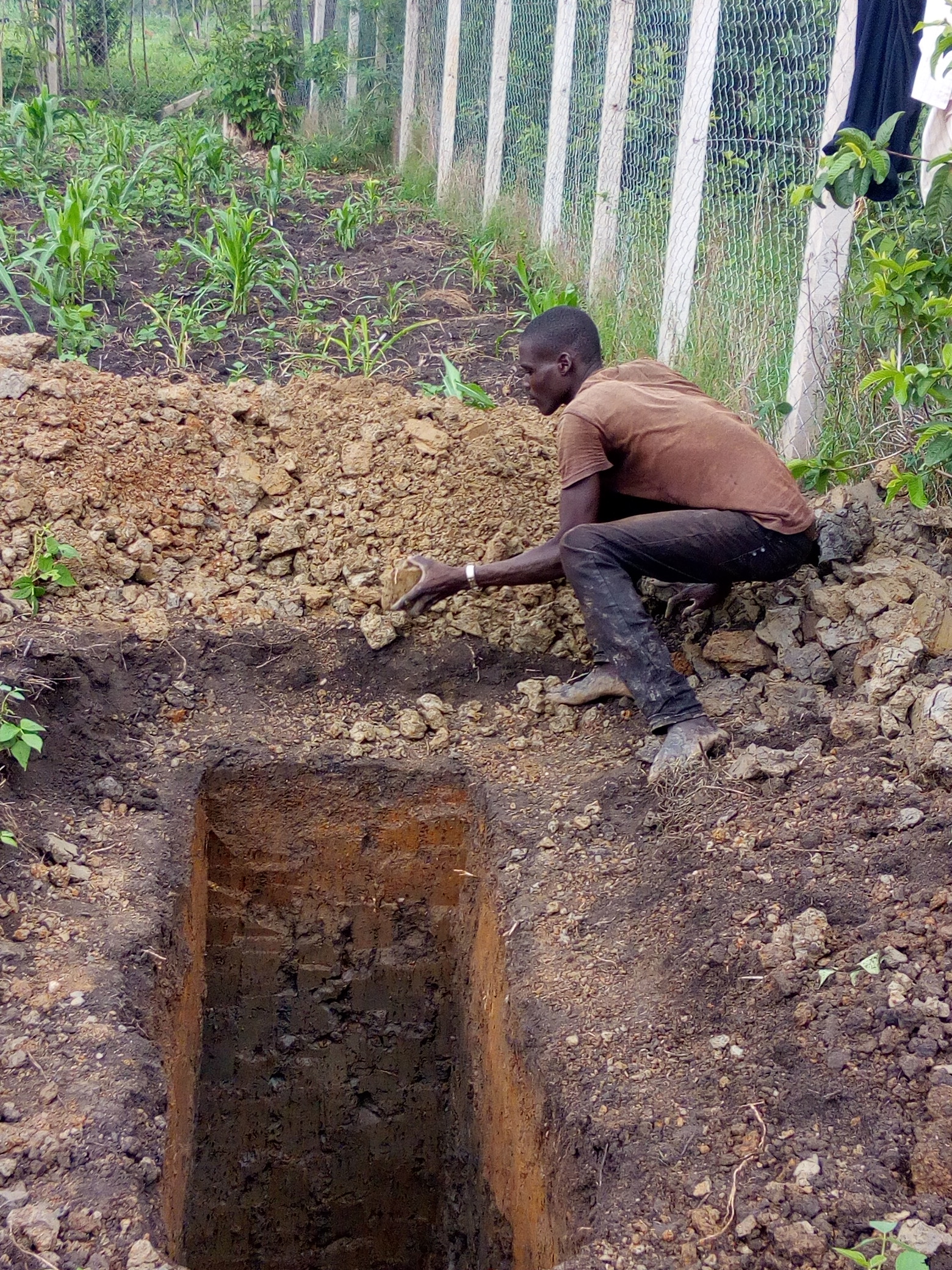Clinic - Photo dated 25 April showing exploratory pit to establish soil content and structure.jpg