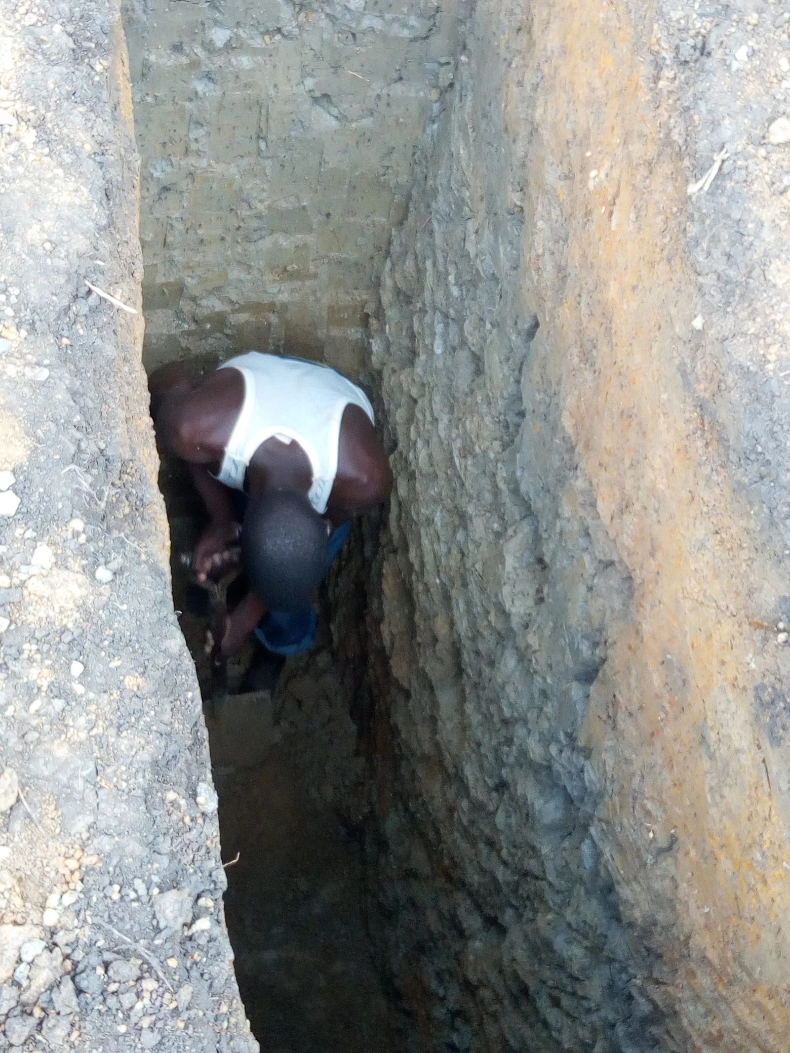 Clinic - Photo dated 25 April showing exploratory pit.jpg
