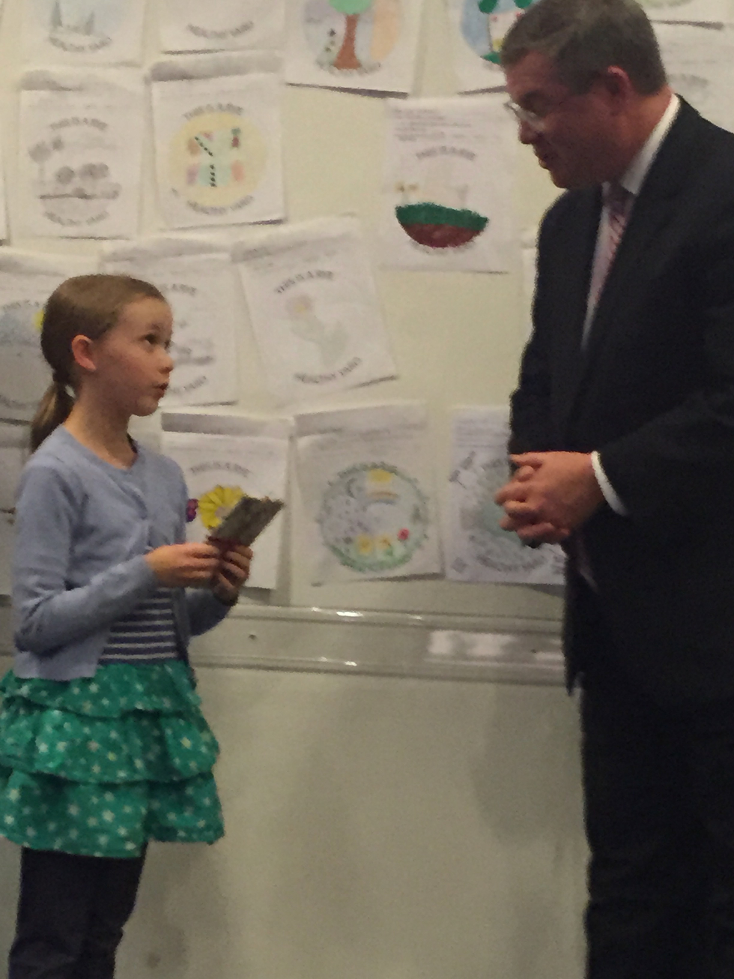 Grand Prize winner Liv McNamara explains to Mayor Sack how she came up with the winning design.