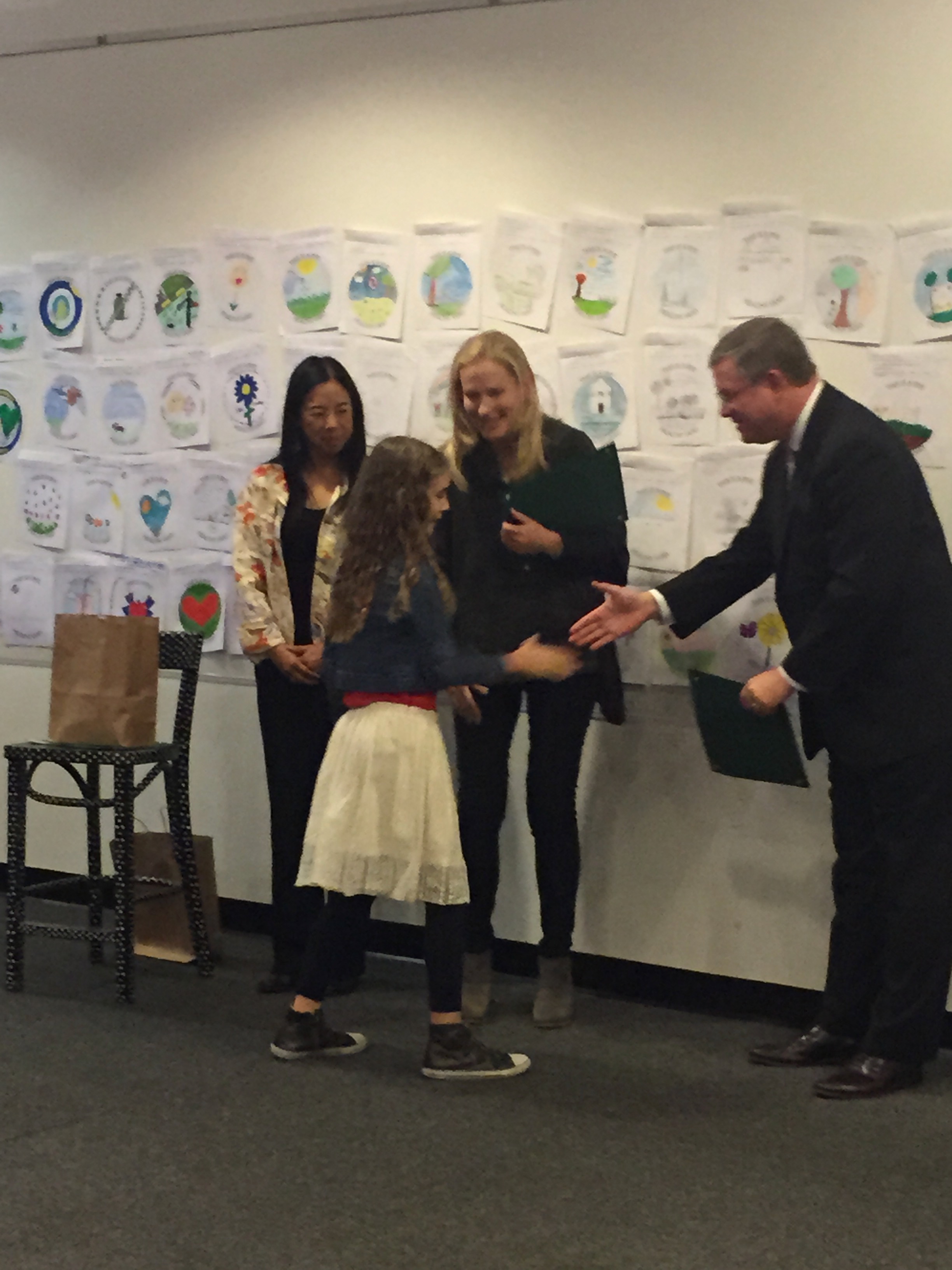 Mattia Gibbs receives her award