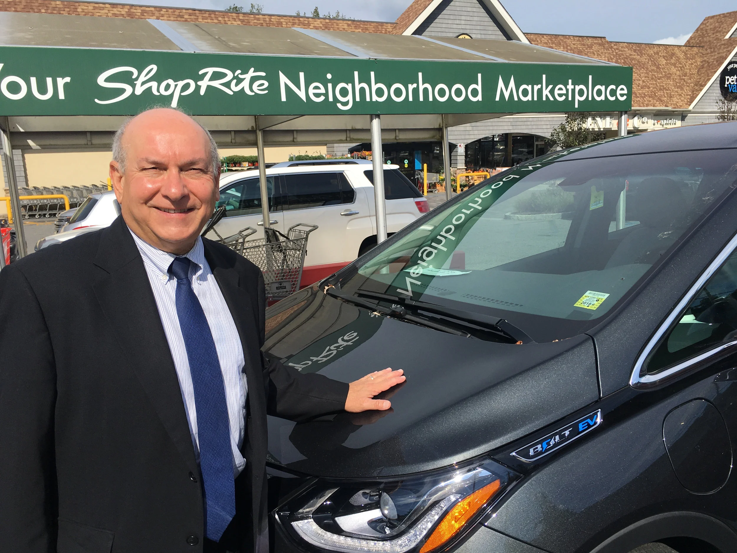 Chris with his Electric Vehicle, the Chevy Bolt