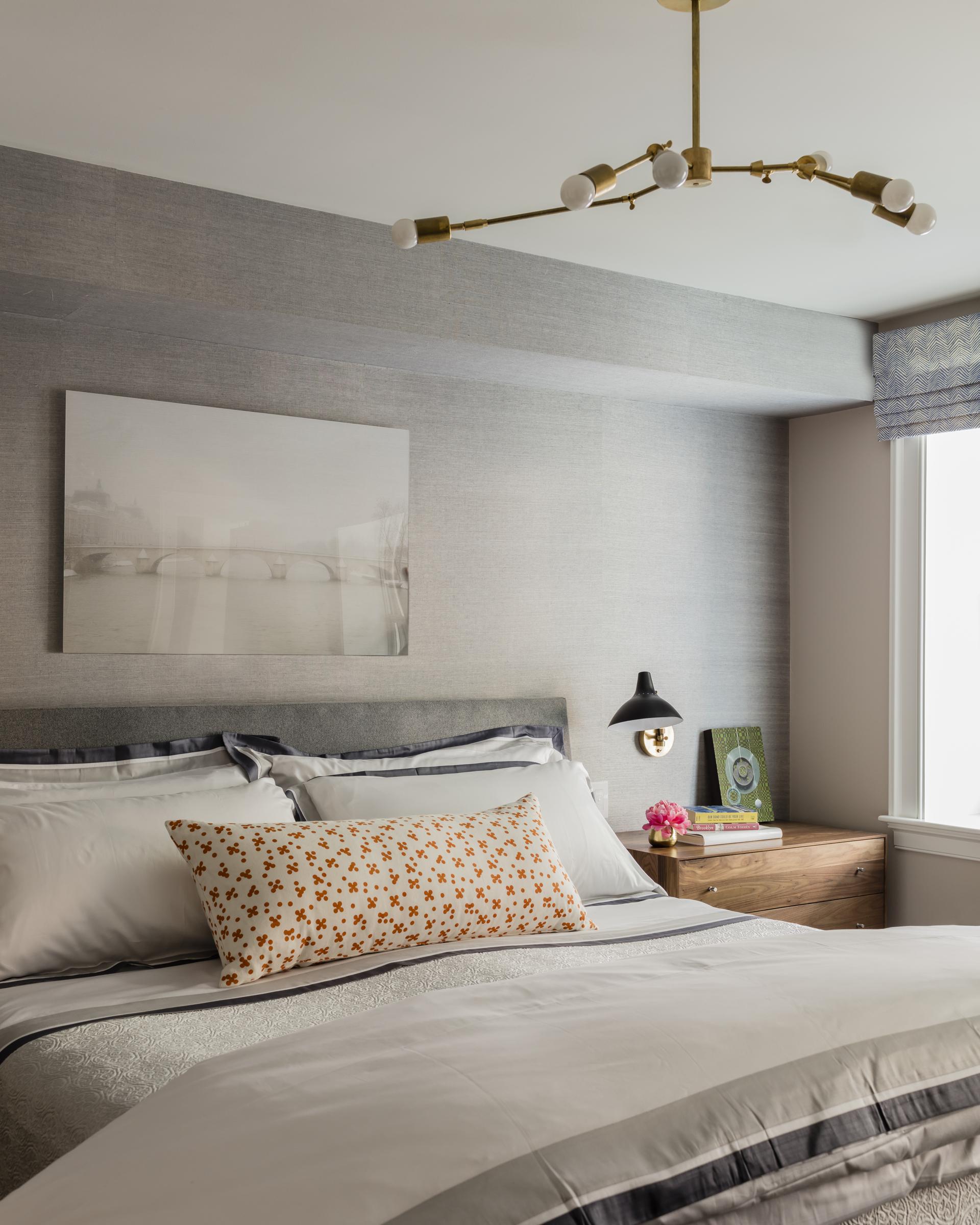 Boston photographer Tess Atkinson’s dreamy Parisian scene hangs over the bed in the master bedroom.