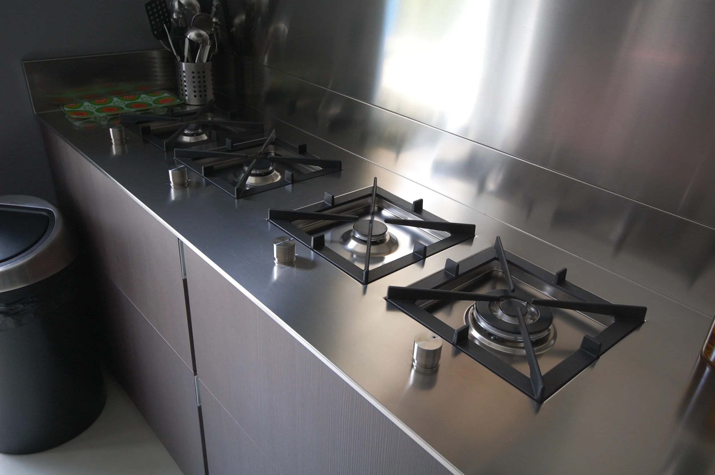 individual gas hobs set within stainless steel worktop