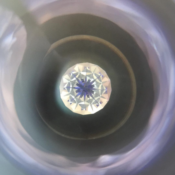Checking the symmetry on one of the stones we faceted, it created a psychedelic portal to another world.