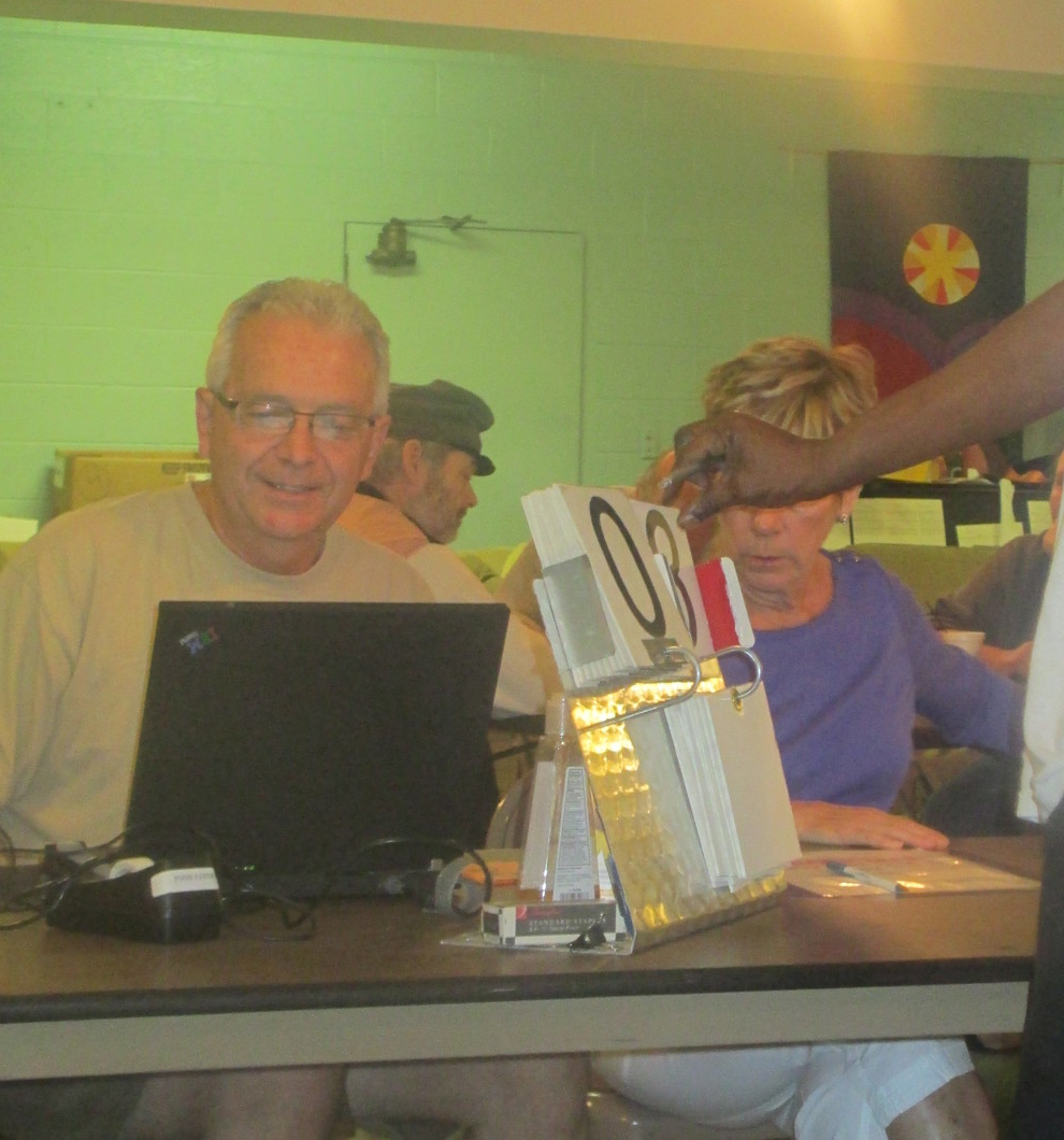 Charlie Goethals (left) cheerfully lending a hand.