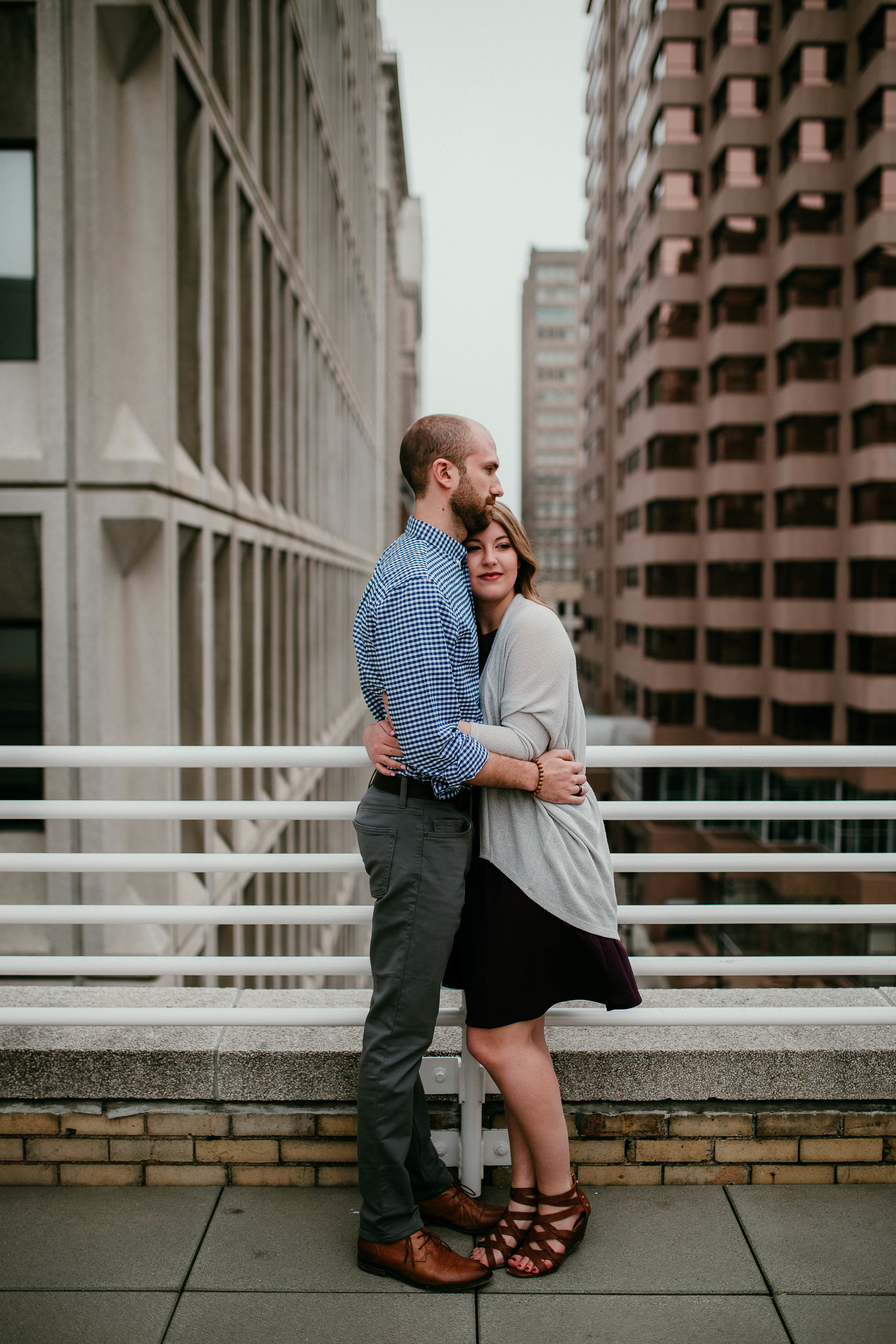 Alex & John: Downtown KC Engagement Session | Hannahill Photography | Kansas City, Mo | rooftop library session urban brick walls | engaged | couples portraits | wedding photographer | lifestyle photographer | documentary love story photographer
