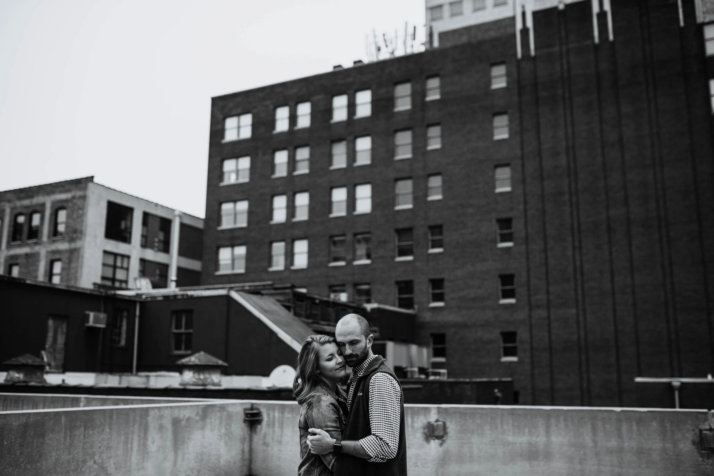 Alex & John: Downtown KC Engagement Session | Hannahill Photography | Kansas City, Mo | rooftop library session urban brick walls | engaged | couples portraits | wedding photographer | lifestyle photographer | documentary love story photographer