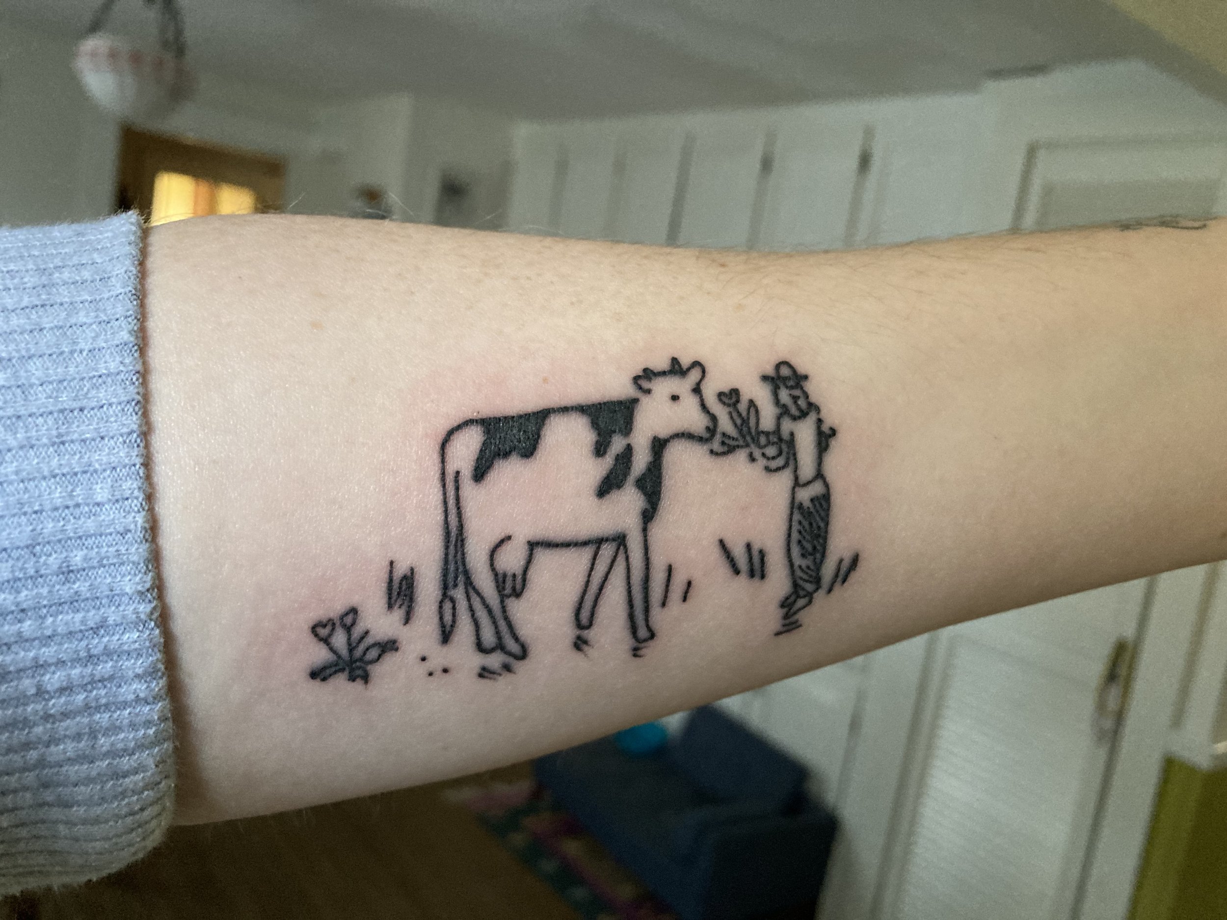 sara cow tatoo!.jpeg