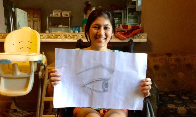 Gaby with the product of her first drawing class