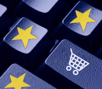 Close-up of a computer keyboard with a shopping cart key