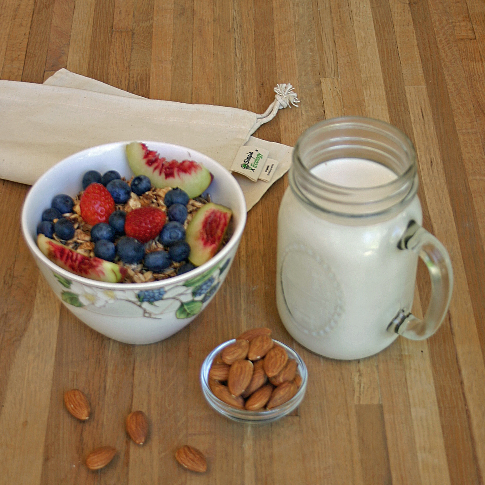 Homemade almond milk, homemade granola, fresh berries & nectarine slices