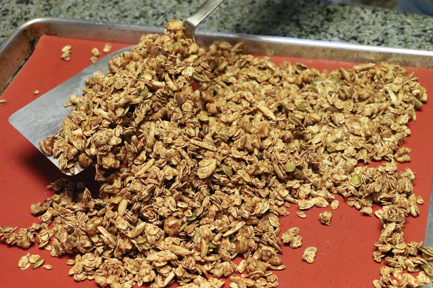 Stirring and baking granola on a reusable baking mat