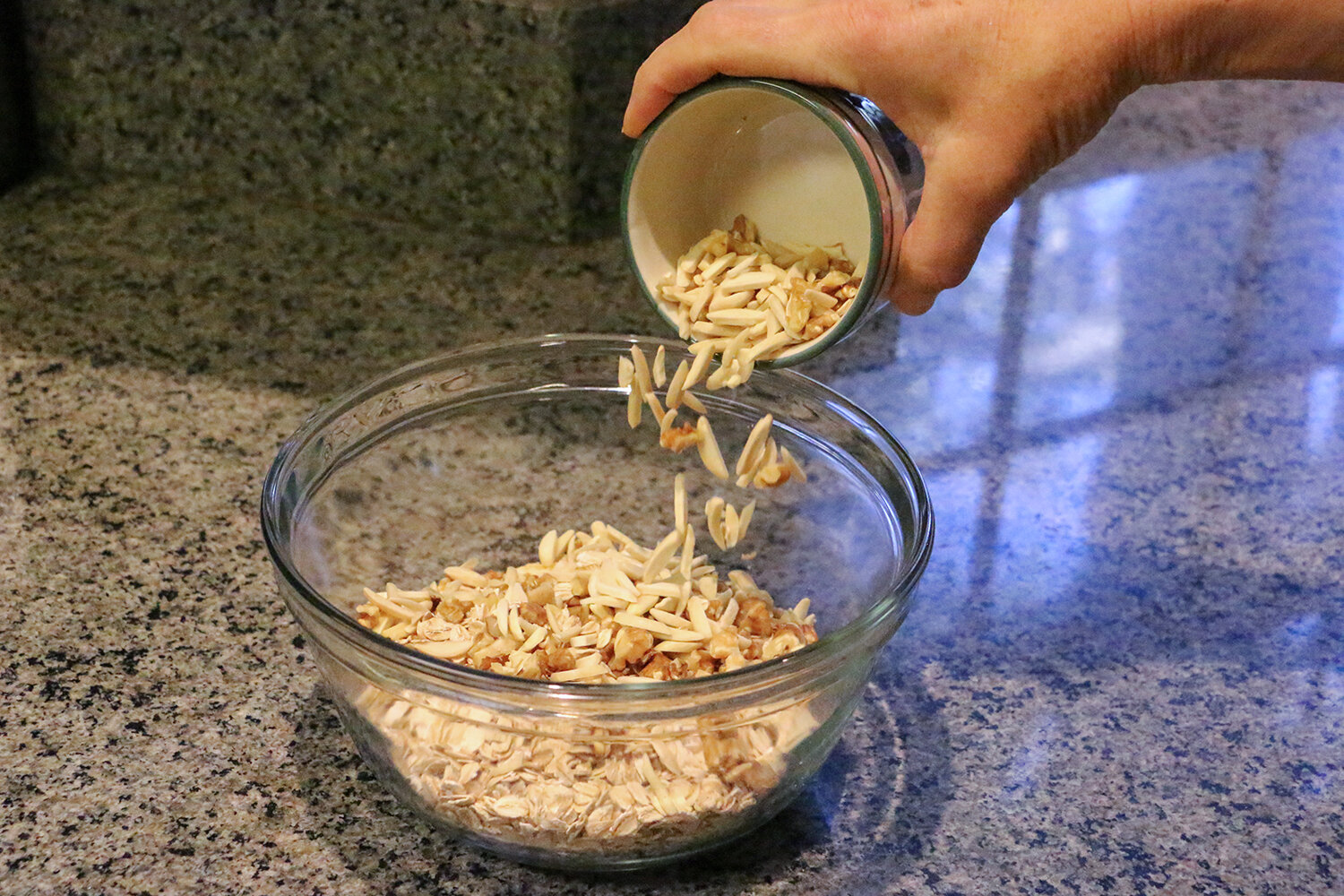 Adding in chopped nuts to rolled oats