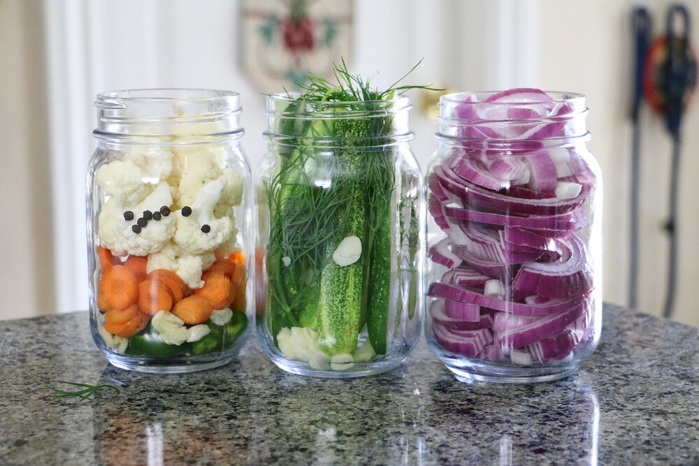 Fresh produce in mason jars ready to pickle