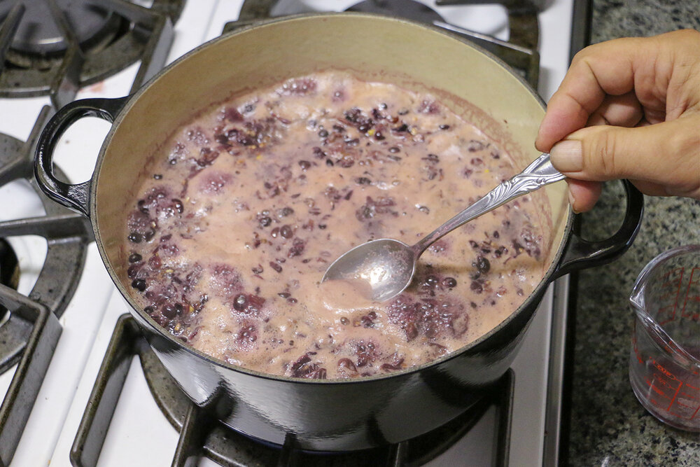 Simmer grapes with juice and skim off foam