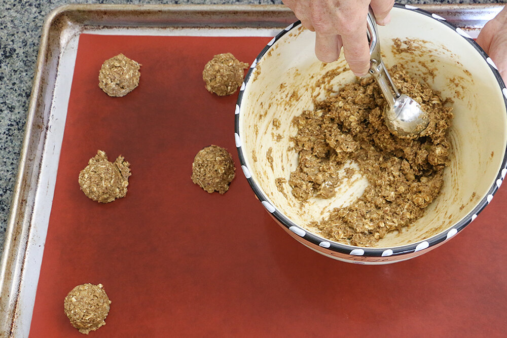 Scoop cookie dough onto reusable silicone baking mat