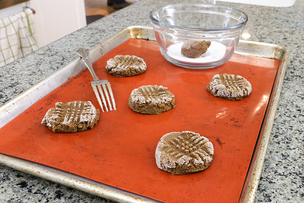 Scoop cookie dough onto reusable cookie baking mat