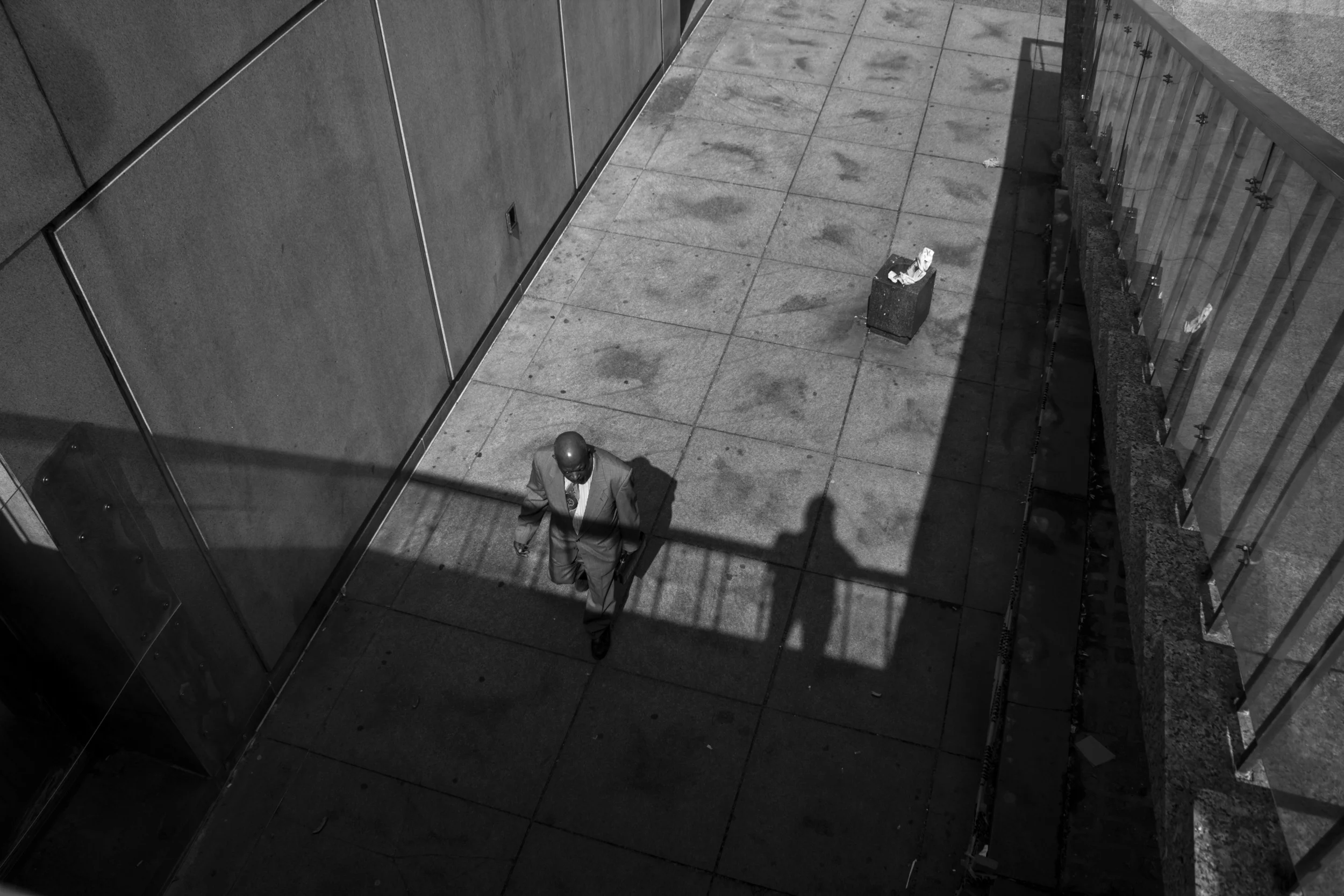 man walks to work through city