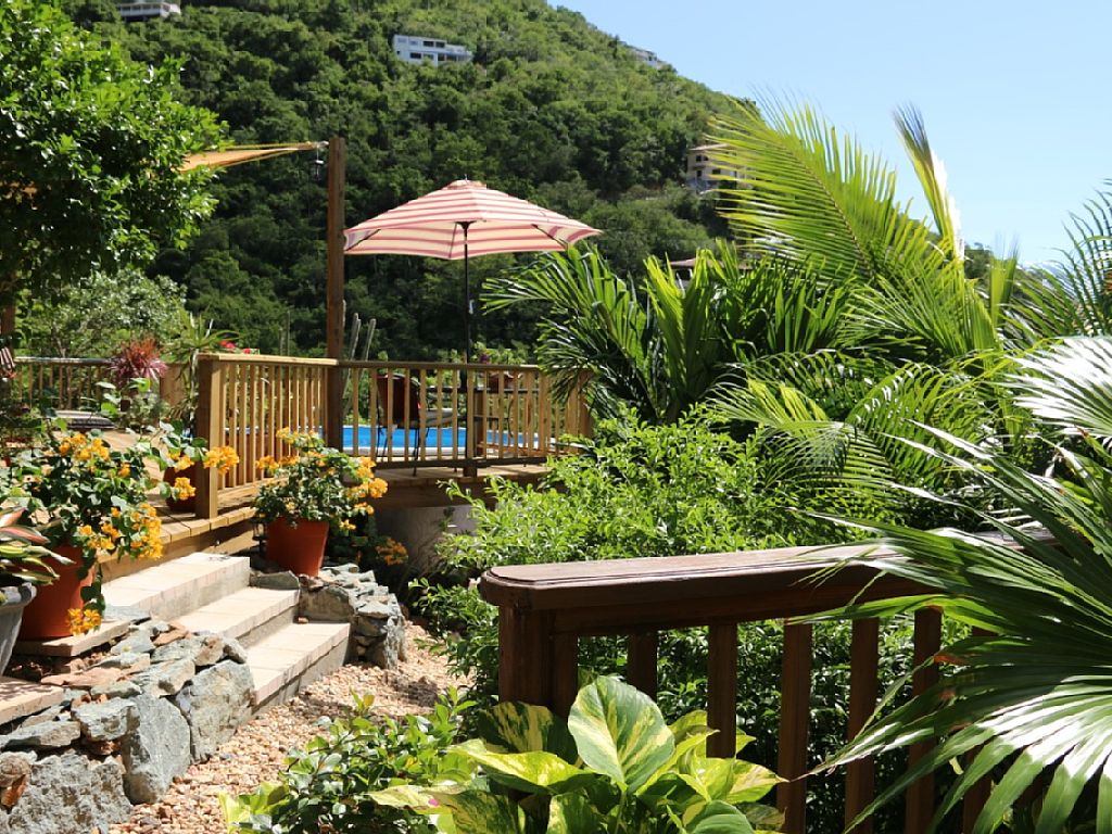 A lush tropical setting surrounds the one bedroom villa and private pool.