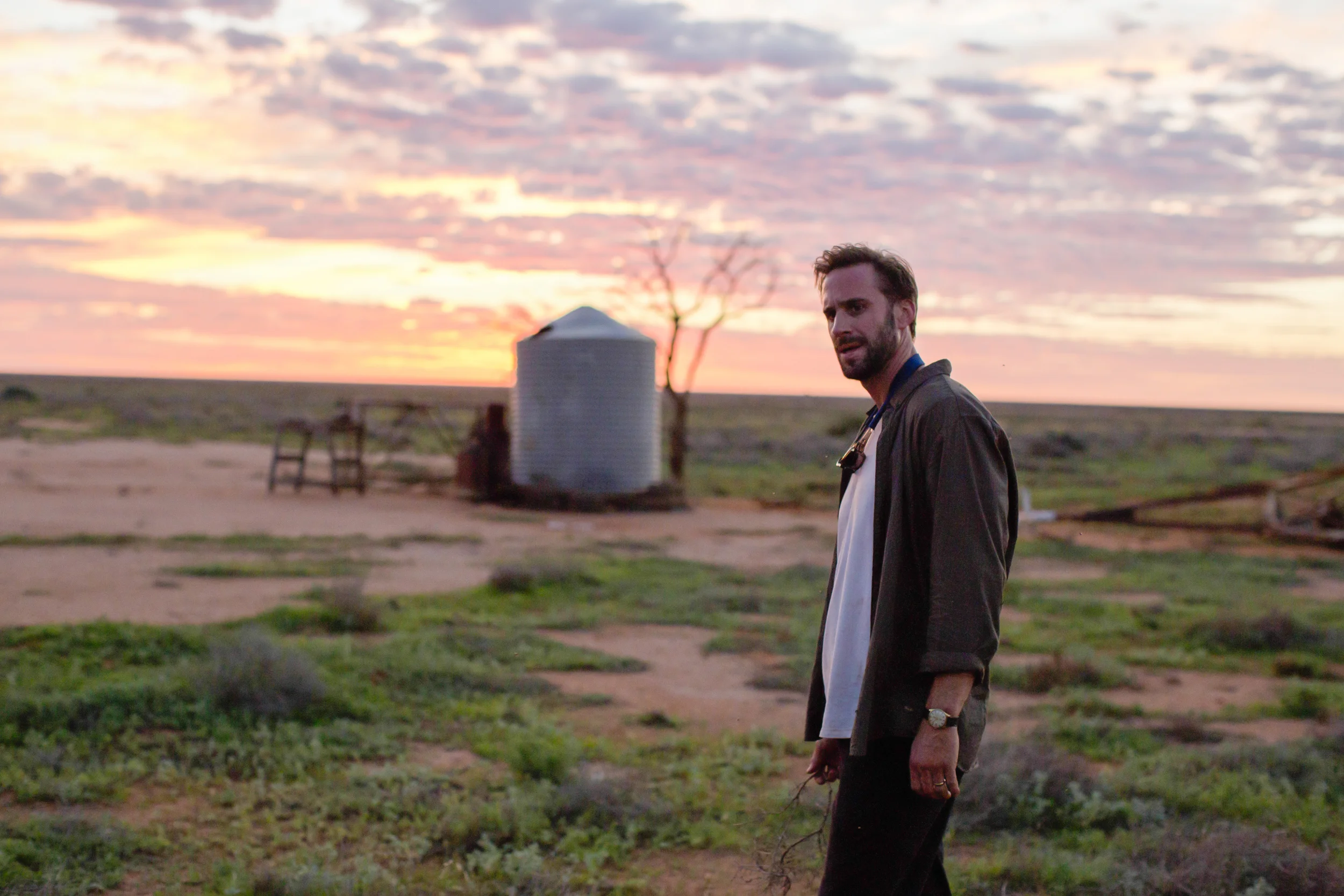 SL41_Matthew Parker (Joseph Fiennes)_Holds Branch In Desert.jpg